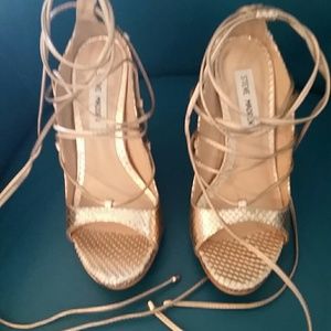 Steve Madden lace up gold color shoes